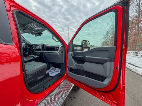 Driver door interior panel and step area in close view.